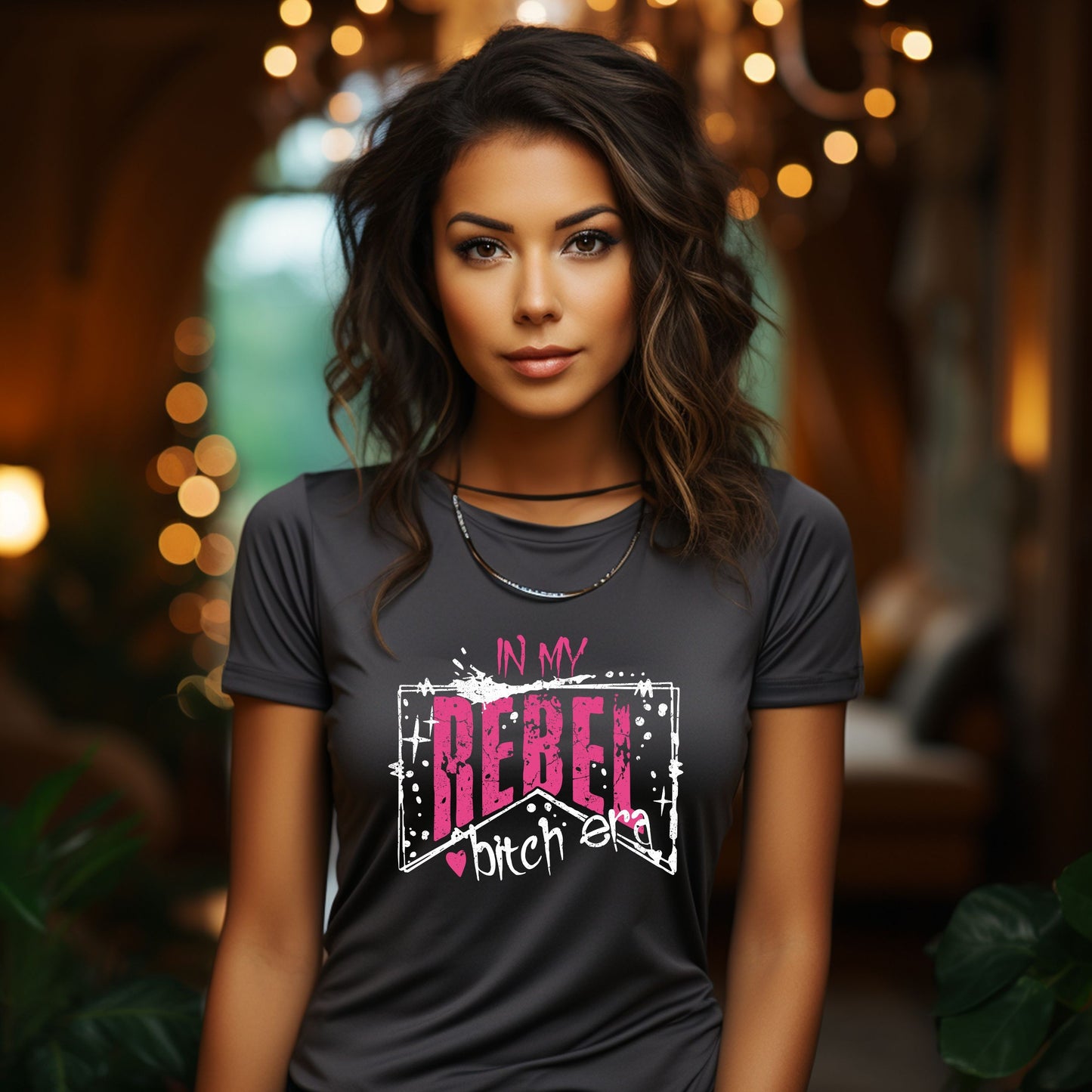 Woman wearing black "In My Rebel Bitch Era" graphic t-shirt with pink and white distressed lettering, edgy bold fashion statement
