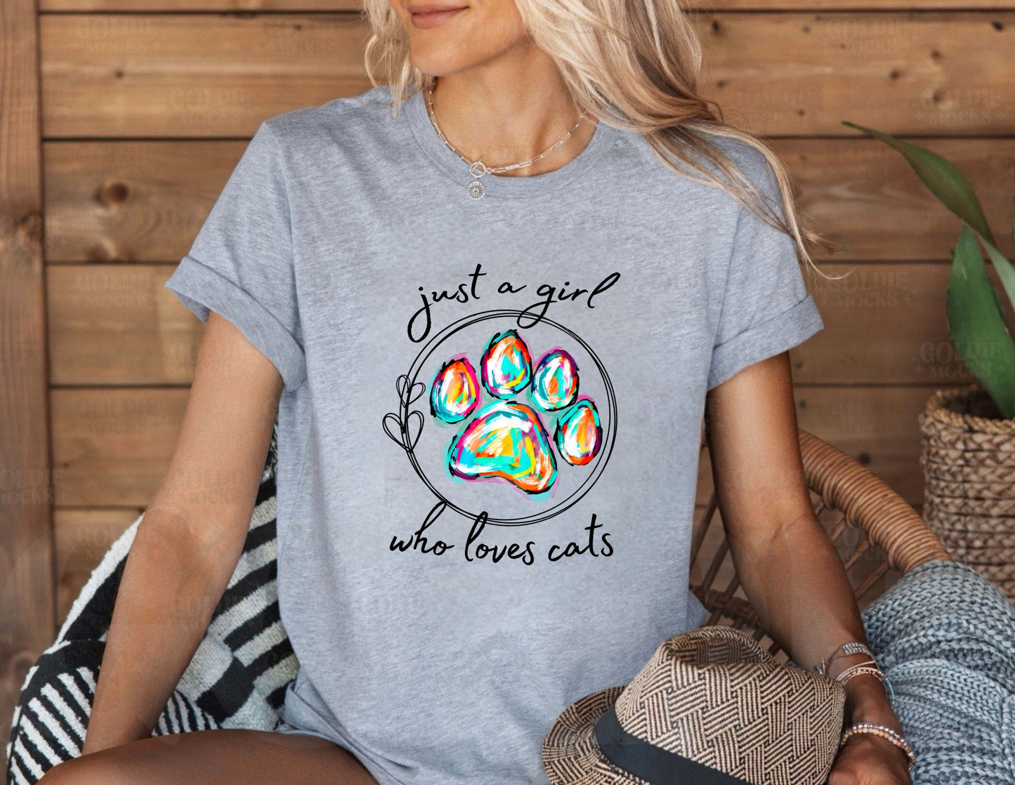 Just a Girl Who Loves Cats T-Shirt – women’s grey cat lover tee with colorful paw print design, perfect for cat moms and animal rescue supporters.