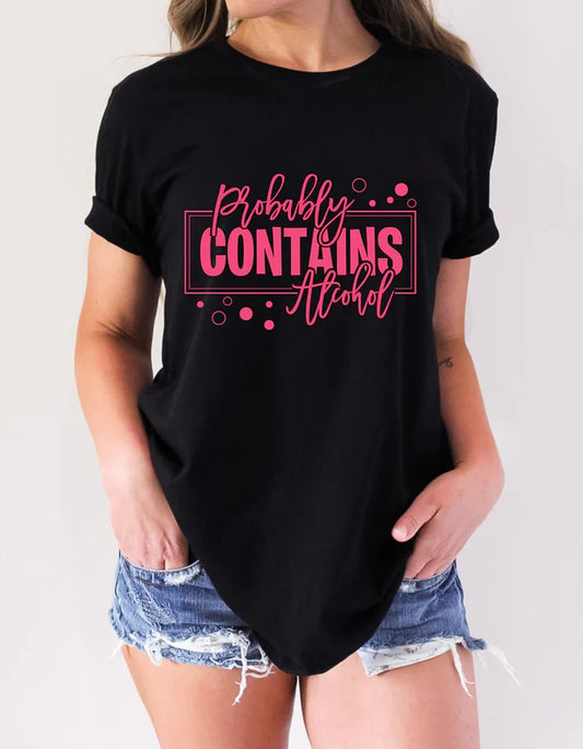 Black Gildan t-shirt with bold pink text that reads “Probably Contains Alcohol” in a mix of block and script fonts, styled for fun casual wear.