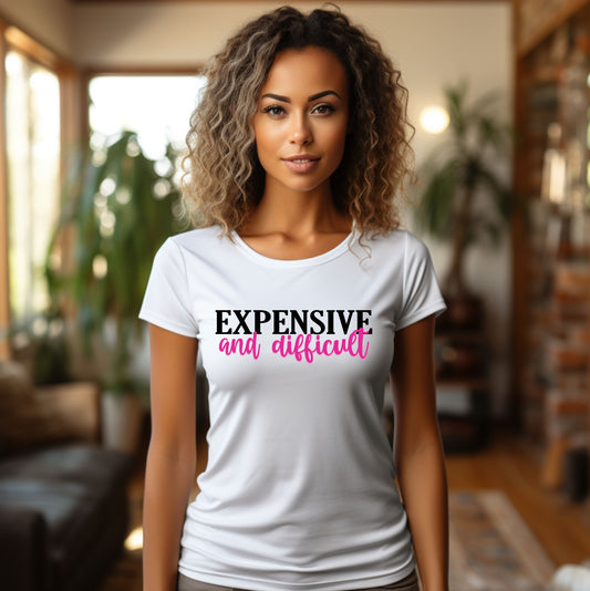 Woman wearing a white “Expensive and Difficult” graphic t-shirt with black and pink text, casual sassy style fashion.