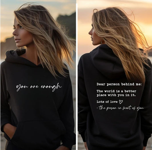 Inspirational hoodie with “You Are Enough” front and “Dear Person Behind Me” kindness message on back – unisex black sweatshirt.